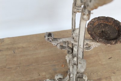Lot 1474 - Antique cast iron plant stand, with six dished holders (one missing) issuing from scrolled frame on scrolling splayed supports, 92cm wide x 108cm high