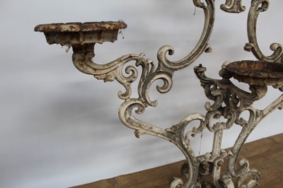 Lot 1474 - Antique cast iron plant stand, with six dished holders (one missing) issuing from scrolled frame on scrolling splayed supports, 92cm wide x 108cm high