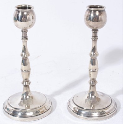 Lot 350 - Pair silver candlesticks with ring decoration on circular bases (London 1912) 18cm high