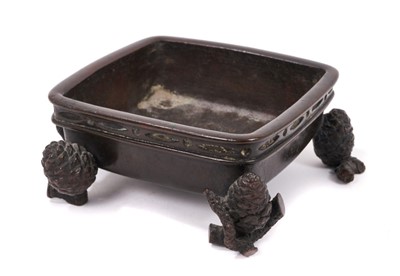 Lot 749 - Japanese bronze censer, of square form raised on pine cone supports, four character signature mark to underside, 14cm wide