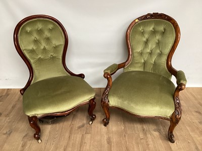 Lot 976 - Two similar Victorian walnut button back chairs, with pale green upholstery