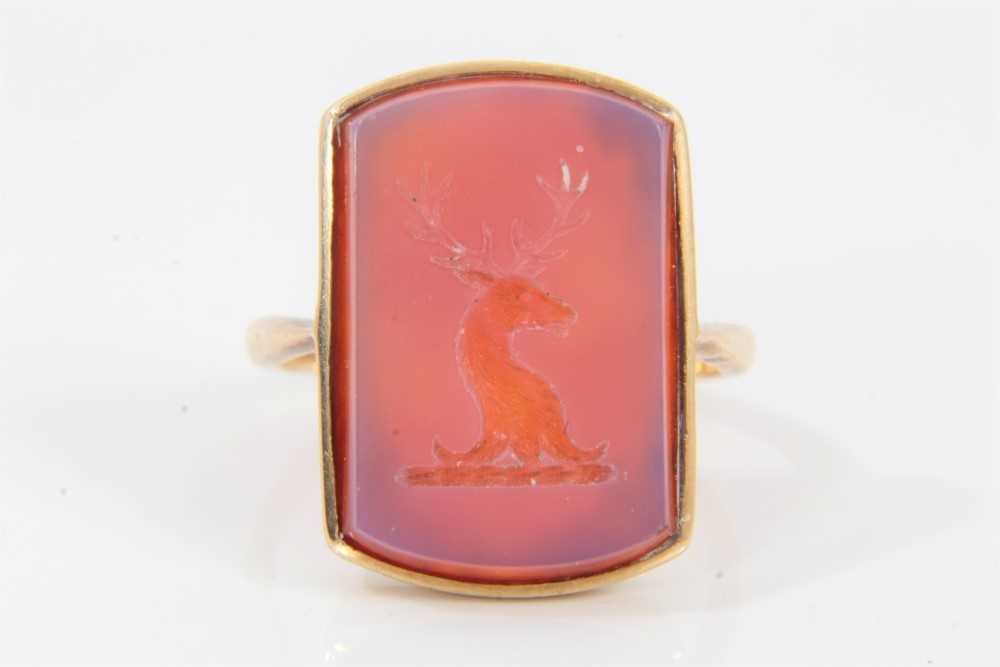 Lot 539 - Antique intaglio signet ring with a rectangular carved carnelian with intaglio stag's head family crest, in 9ct gold mount, size N.