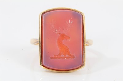 Lot 539 - Antique intaglio signet ring with a rectangular carved carnelian with intaglio stag's head family crest, in 9ct gold mount, size N.