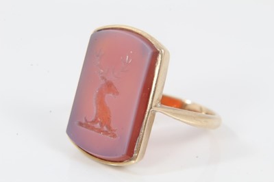 Lot 539 - Antique intaglio signet ring with a rectangular carved carnelian with intaglio stag's head family crest, in 9ct gold mount, size N.