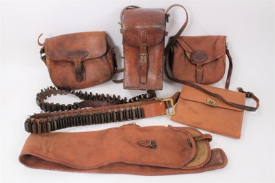 Lot 886 - Late Victorian/Edwardian leather cartridge bag, two others, gun slip, cartridge belts and other items