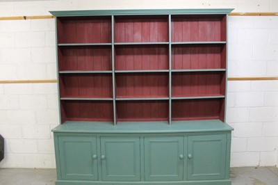 Lot 1506 - Very large painted pine bookcase, with open shelves and enclosed cupboards below on plinth,  230cm wide x 52cm deep x 225cm high