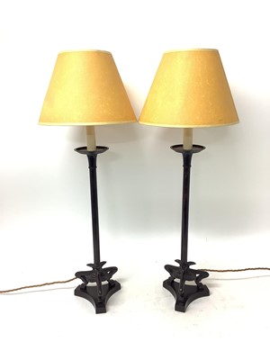 Lot 1511 - Pair of modern bronze lamps by Besselink & Jones, London, in the Empire style, raised on tripod supports and shaped bases, 69cm high including shades