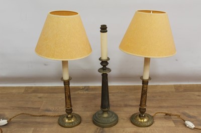 Lot 1512 - Pair of 19th century style brass lamps, with shades 56cm high, together with a similar lamp. (3)