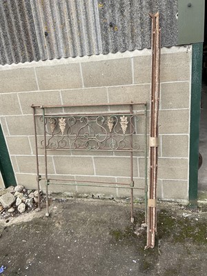 Lot 361 - Continental child's iron bed with scrolled ends and bars, green painted, 97cm wide