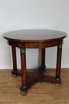 Lot 1447 - 19th century French Empire mahogany and metal mounted centre table, with circular top raised on column supports and X-framed stretcher on paw feet