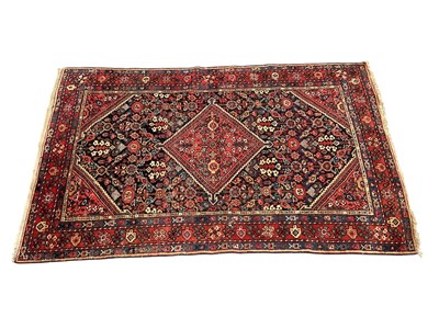 Lot 1487 - Persian rug with central lozenge medallion