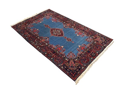 Lot 1483 - Fine Kashan rug with sapphire blue ground