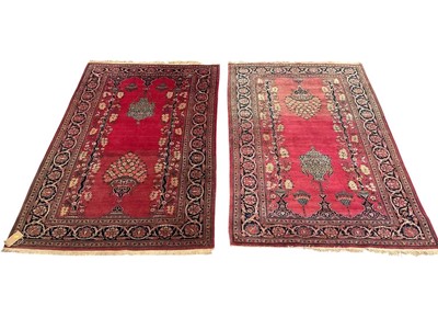 Lot Fine pair of pink ground Pakistani Kashan design rugs