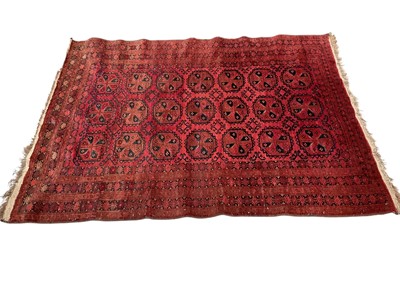Lot 1482 - Afghan Belouche rug with three rows of seven quartered medallions