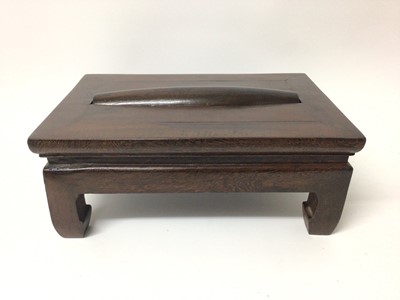 Lot 1390 - Chinese hardwood foot rest massage footstool 'Gundeng', with rectangular top set with a cylindrical roller, raised on four stout legs, 42cm wide