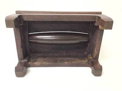 Lot 1390 - Chinese hardwood foot rest massage footstool 'Gundeng', with rectangular top set with a cylindrical roller, raised on four stout legs, 42cm wide