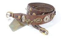 Lot 527 - Brown leather belt, mounted with over twenty...