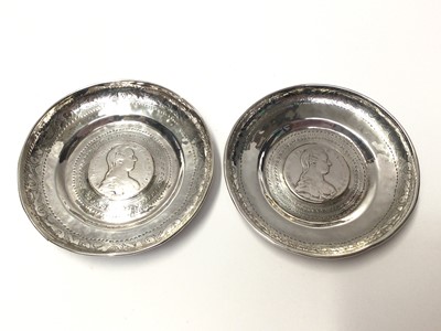 Lot 22 - Two Continental silver dishes mounted with coins