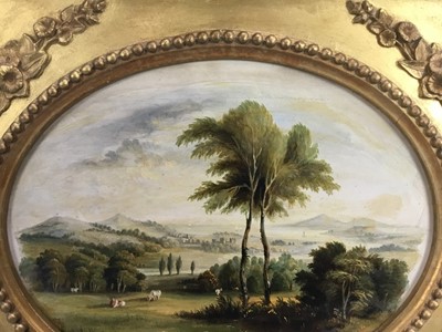 Lot 104 - English School late 19th Century, oil on artist board, An oval of an extensive landscape with cattle near trees in the foreground, in original gilt frame. 19 x 23cm.