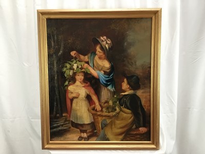 Lot 32 - Early 20th century English School, oil on canvas board - a family group in a landscape with mother putting flowers in her daughter's hair, initialled E.D.K., in gilt frame.  60 x 50cm
