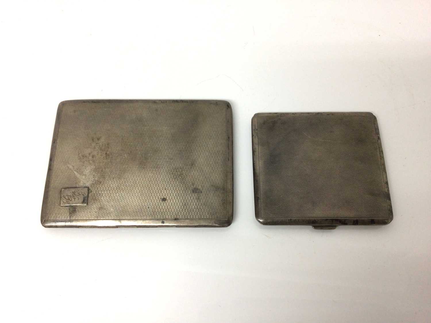 Lot 21 - Two George V silver cigarette cases with engine turned decoration, various dates and makers