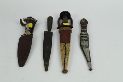 Lot 864 - Antique Eastern silver mounted Jambiya knife with niello decoration, together with three other African and Middle Eastern knives and daggers. (4)