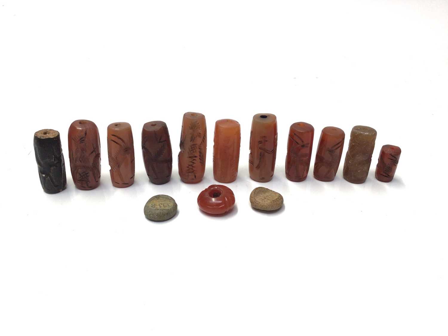Lot 42 - Collection of Chinese carved carnelian tubular beads and others