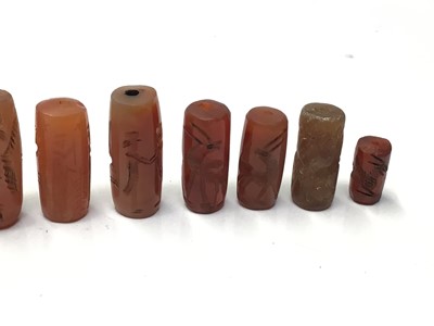 Lot 42 - Collection of Chinese carved carnelian tubular beads and others
