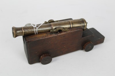 Lot 775 - Small 19th century Bronze signalling cannon on later oak gun carriage