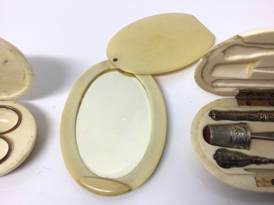 Lot 6 - Two 19th century ivory cased etui cases and cased mirror