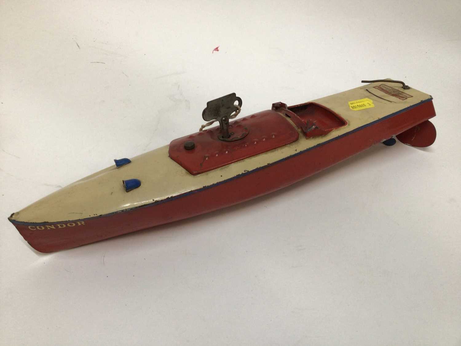 Lot 1895 - Hornby clockwork speedboat, together with an antique doll
