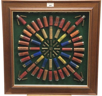 Lot 940 - Decorative display of shotgun cartridges and rifle shells to include Eley, Purdy and others, in glazed frame, 55cm square overall