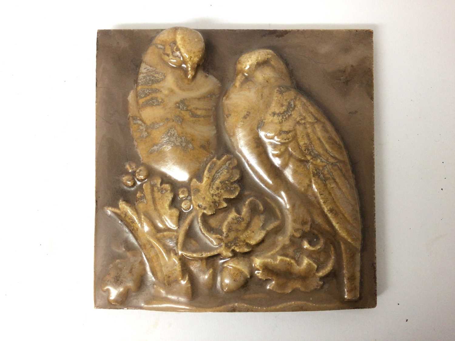 Lot 50 - Unusual 1920s ceramic plaque with relief moulded decoration depicting two birds