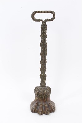 Lot 831 - Regency brass mounted door stop with lion's paw