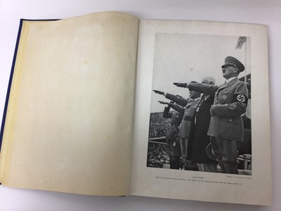 Lot 1413 - 1936 Berlin Olympics real photographic and artist drawn postcards in album and book.