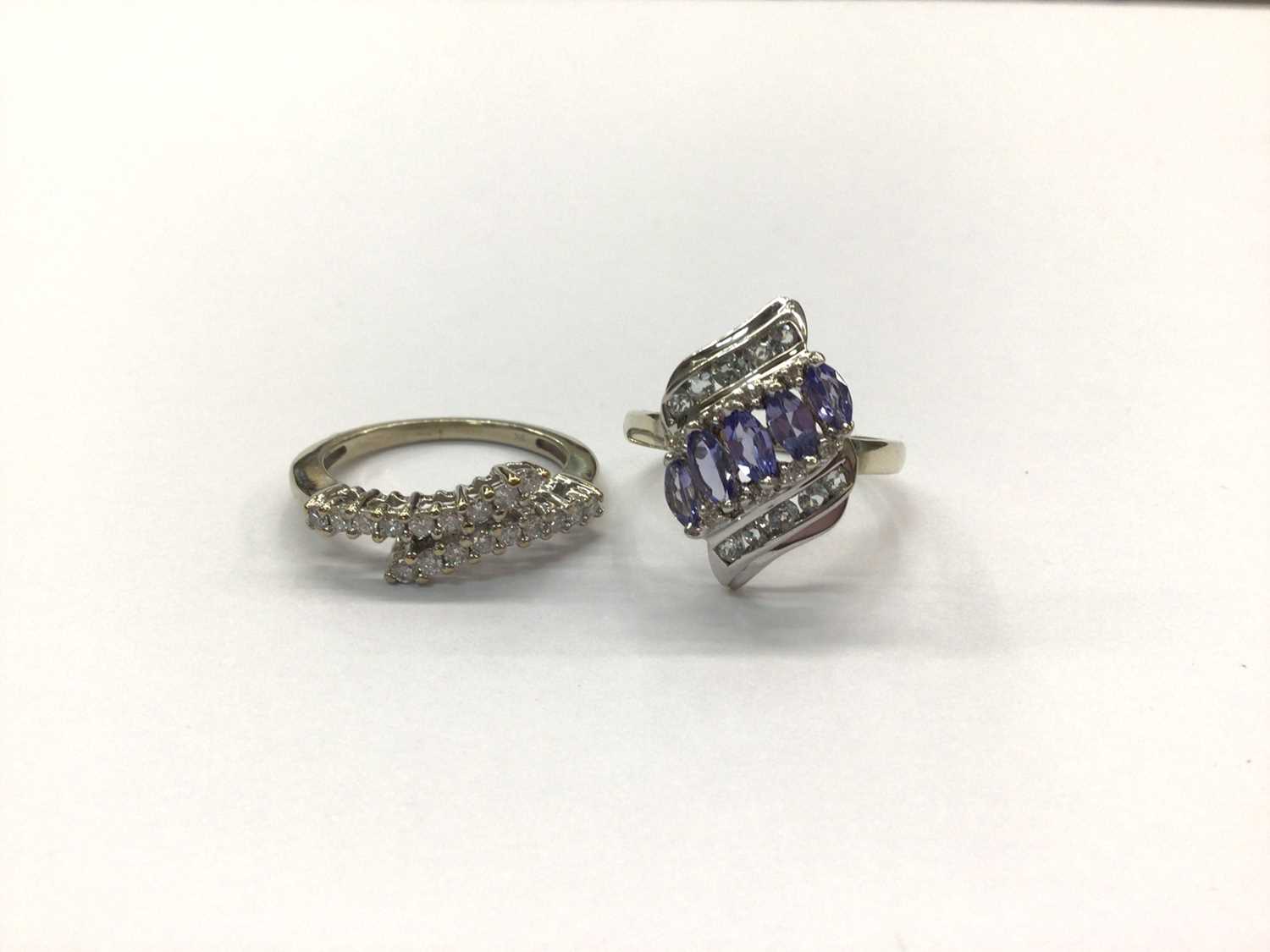 Lot 654 - 9ct white gold diamond set crossover ring