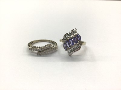 Lot 654 - 9ct white gold diamond set crossover ring and 9ct white gold tanzanite ring