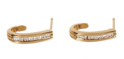 Lot 541 - Pair of diamond 18ct gold half hoof earrings