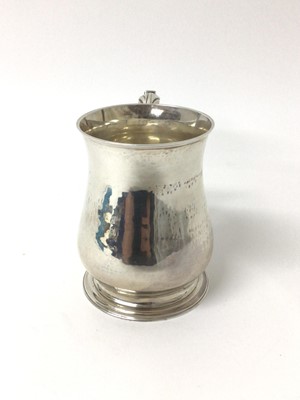 Lot 72 - George II style silver pint tankard of baluster form, London 1938.