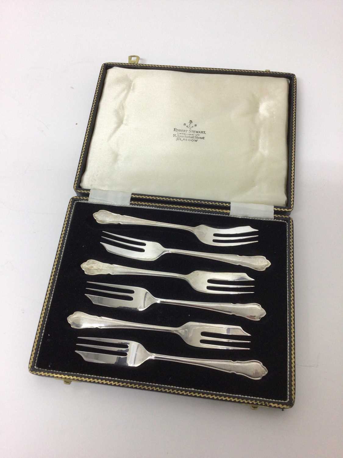 Lot 74 - Set of six silver Du Barry pattern cake forks in original fitted box