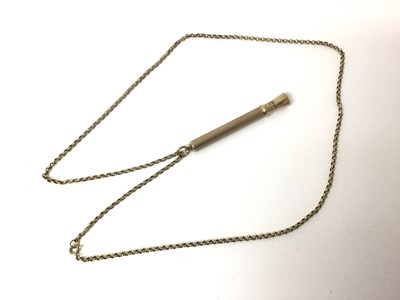 Lot 67 - 9ct gold cigar pricker and a yellow metal chain