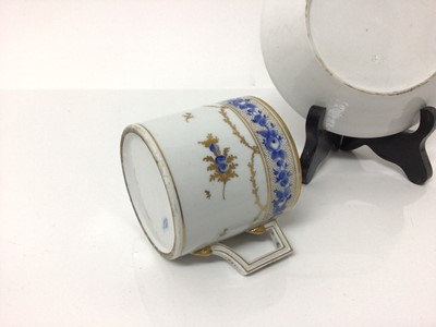 Lot 9 - Continental Nyon porcelain cup and saucer, late 18th/early 19th century, with blue enamelled and gilt floral patterns and swags, underglaze blue fish marks, the saucer measuring 13.5cm diameter