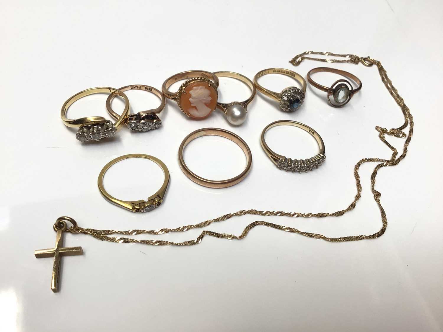 Lot 58 - Group of gold rings to include three 18ct gold rings, six 9ct gold rings and 9ct gold cross on chain