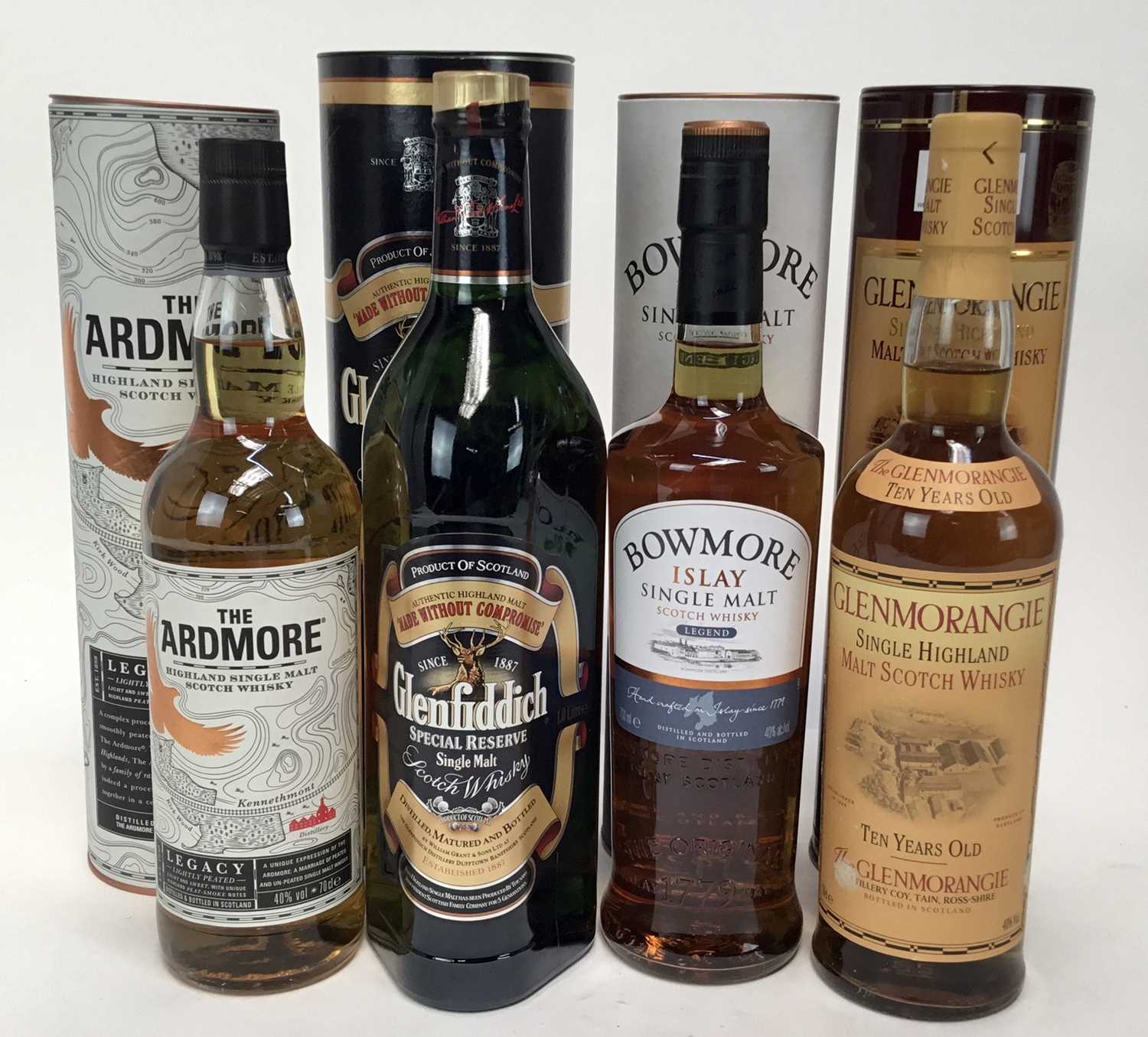 Lot 17 - Whisky - four bottles, Bowmore Islay Single Malt, Genfiddich (1 litre), Glenmorangie Ten Years Old and The Ardmore, each in orignal tube