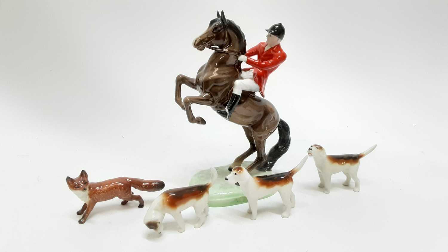 Lot 1261 - Beswick Huntsman on rearing horse, model no 868, together with a Beswick for and three hounds