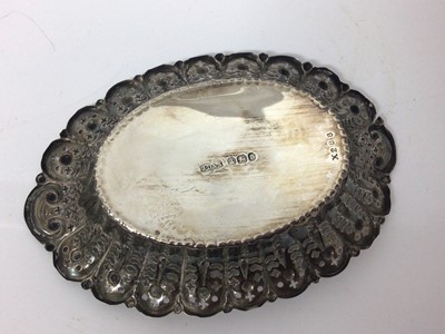 Lot 30 - Three silver graduated rectangular dishes with pierced and floral decoration and one other oval silver dish (4)