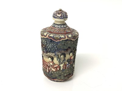 Lot 28 - 19th century Chinese ivory carved and stained snuff bottle, decorated with figural scenes, seal mark to base, 12cm high