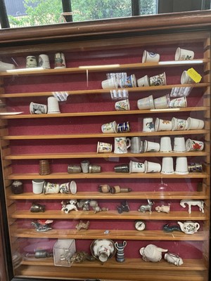 Lot 205 - Two wall hanging curiosity cabinets, silver plate, hand puppet and other items