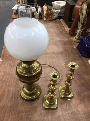 Lot 580 - Two boxes of assorted brass ware including an oil lamp converted to electricity