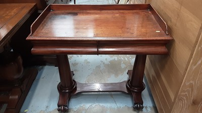 Lot 869 - Early Victorian mahogany library table/writing table with ledge back and two moulded frieze drawers on two cannon barrel cylinderical end standards joined by stretcher on scroll feet